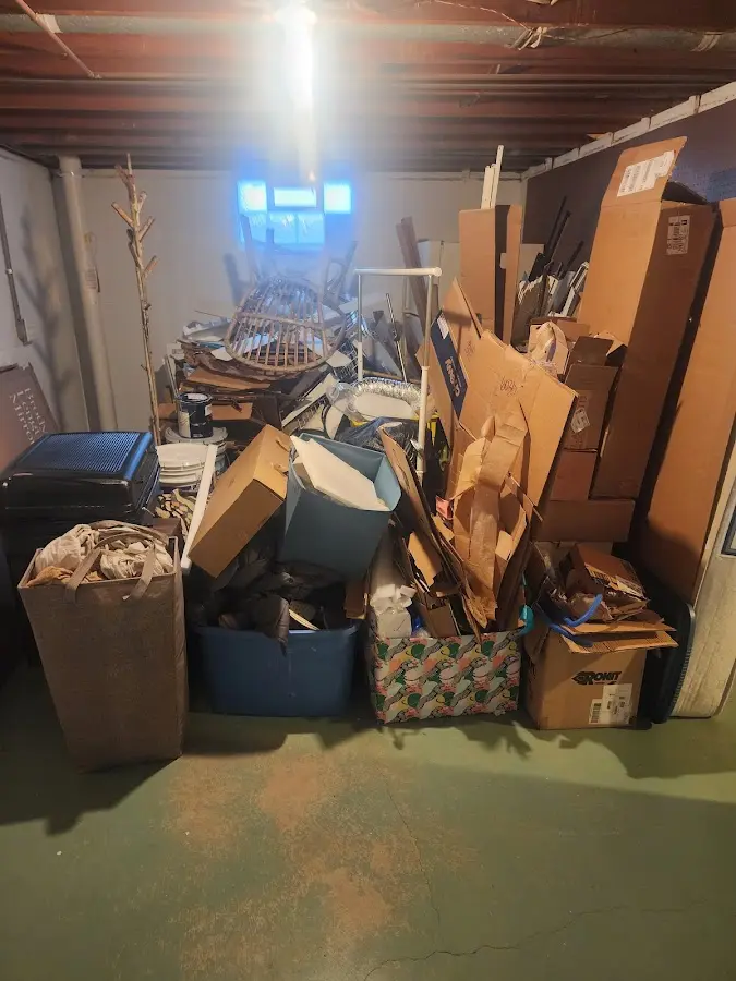 Roll-off dumpster container at job site for 2 Yard Dumpster Rental in Waltham